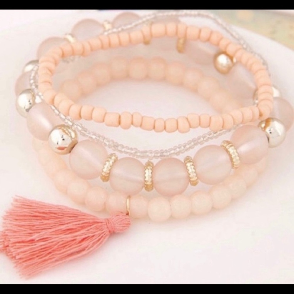 Pink tassel four piece bracelet set
